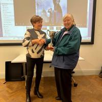 Patricia Donohue being presented with the Sweeney Cup from Ann Sweeney